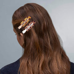Cptots assorted five-color clips laid out for styling options