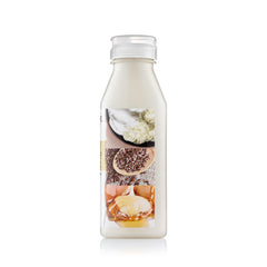 Creme of Nature pump and label close-up highlighting ingredients