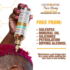 Creme of Nature oil poured to show texture and quick-absorbing benefit