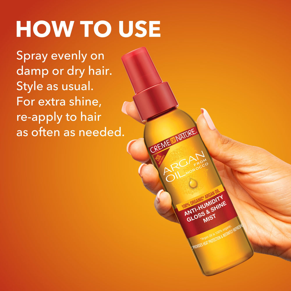 Creme of Nature 4 oz bottle in hand showing portable size and convenience benefit