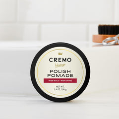 Cremo pomade styled slick-back on model delivering polished long-lasting hold