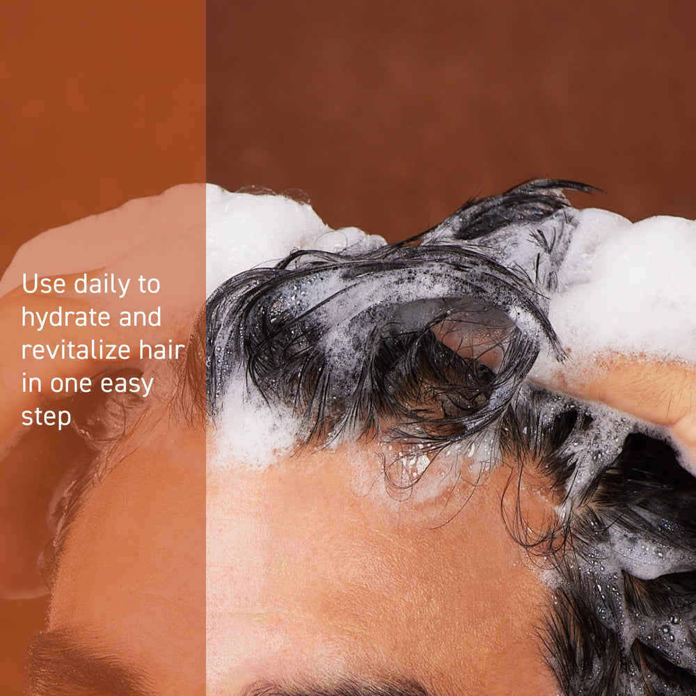 Cremo bottle dispensing lather on hand, demonstrates rich cleansing foam
