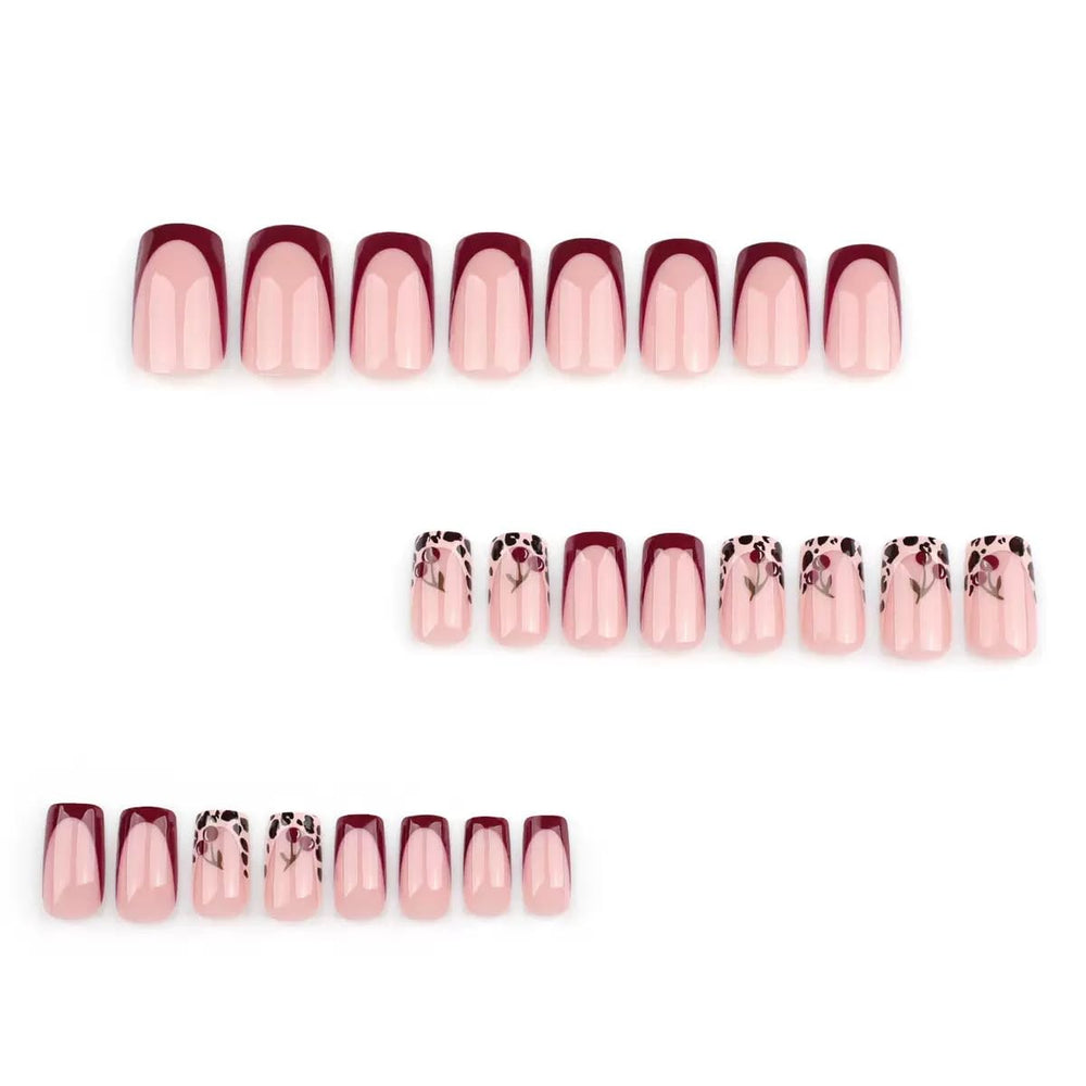 CTTHNBD close-up of French tips with leopard and cherry design highlighting style