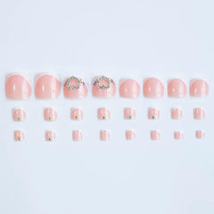 CTTHNBD close-up of tiny heart accent on a French tip nail highlighting delicate decorative detail