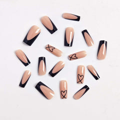 CTTHNBD close-up of heart design detail on glossy black French tip for style