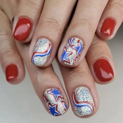 CTTHNBD hand wearing short square red and blue nails demonstrating comfortable everyday use