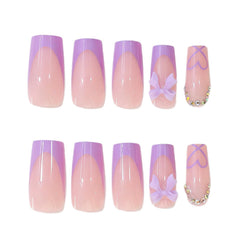 CTTHNBD hand applying a press-on nail demonstrating quick at-home use and convenience