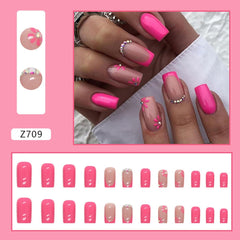 CTTHNBD closeup of floral detail on square tip nails, highlighting decorative precision