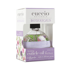 Hand applying Cuccio oil to cuticles, demonstrates quick absorption and hydration