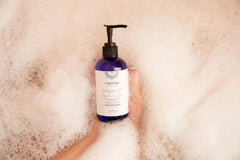 Cuccio arranged ingredients Epsom salt lavender and shea butter highlighting natural calming benefits