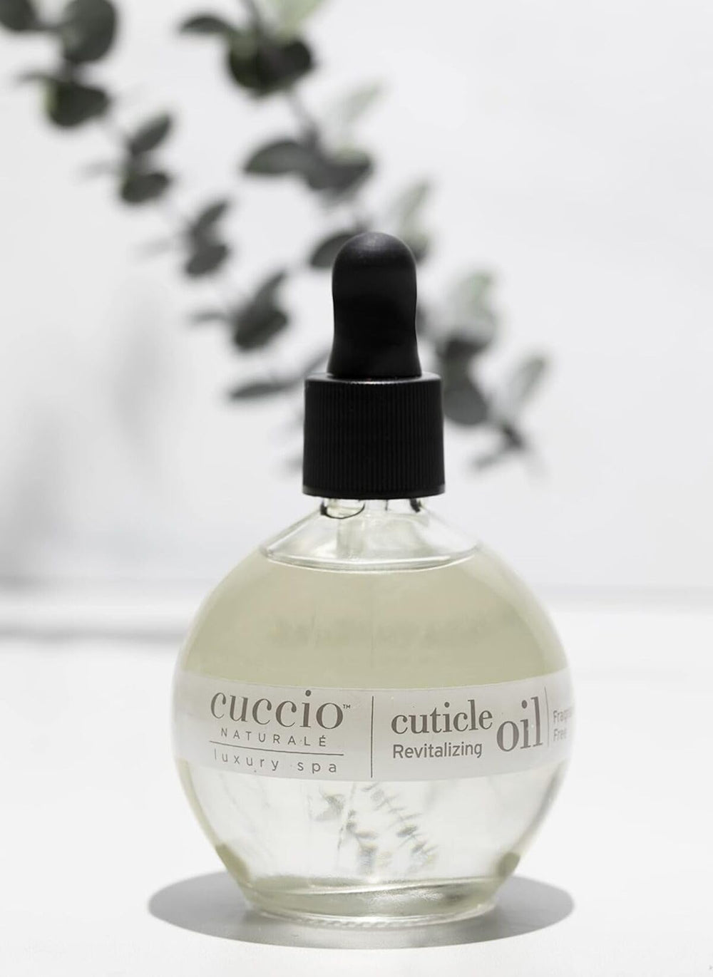 Cuccio on vanity near towels demonstrating salon-quality at-home nail care