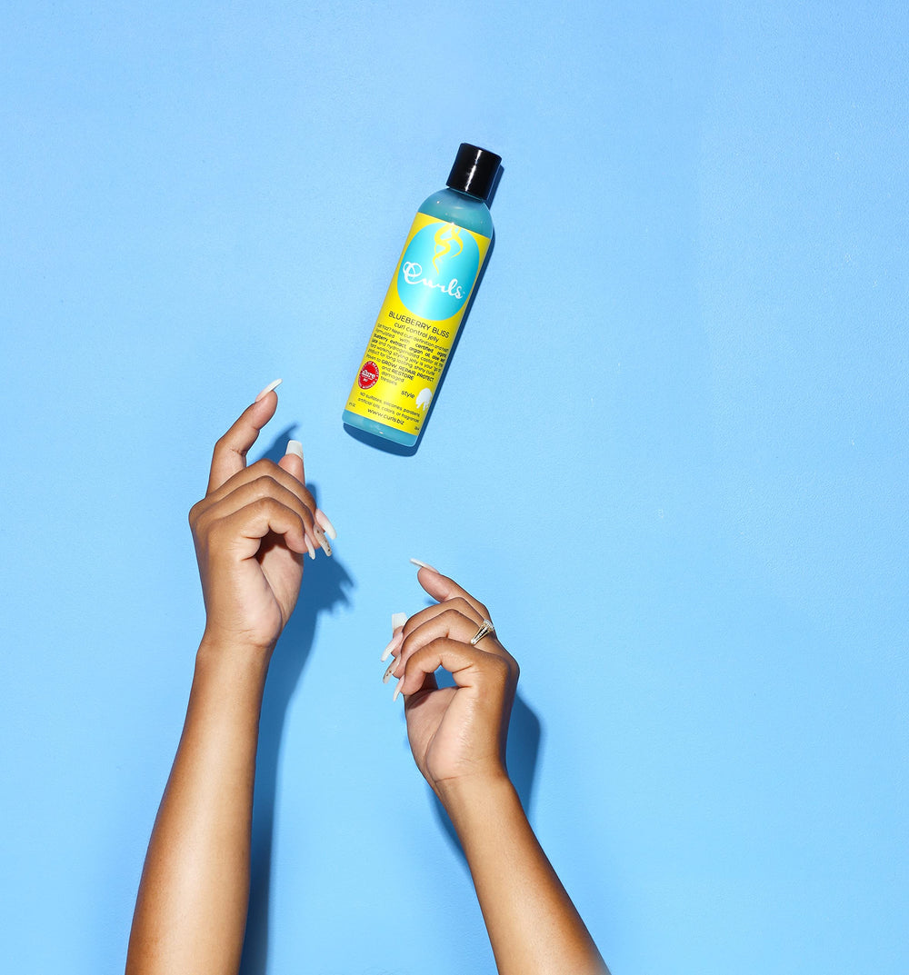 Curls blueberry bliss on twist out showing defined, frizz-controlled curls and shine