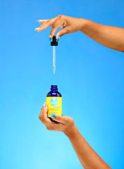 Curls Blueberry Bliss oil drop close-up showing lightweight texture