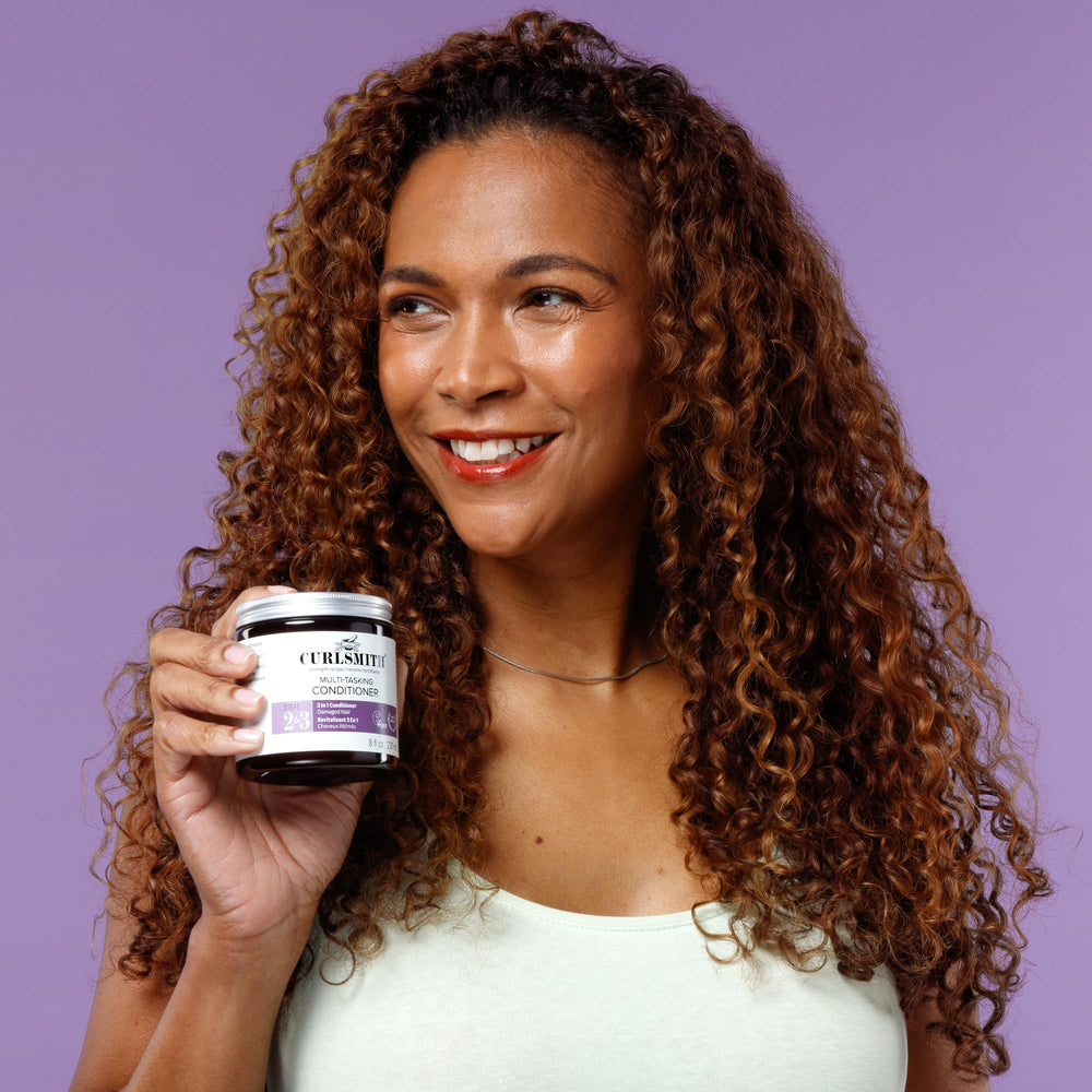 CURLSMITH 2 oz jar beside a hand for size comparison and travel-friendly advantage
