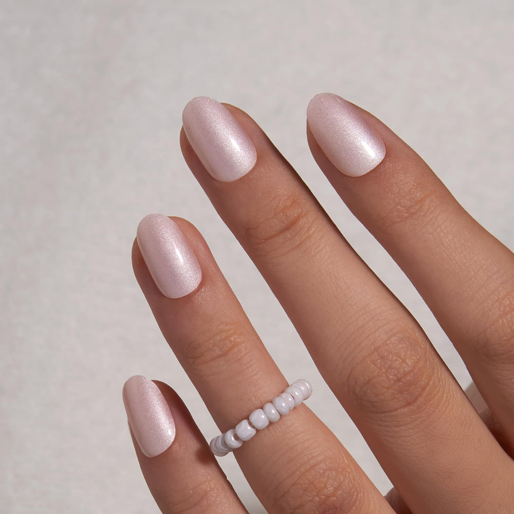CurvLife nails on a hand typing at a desk demonstrating durability