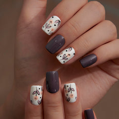 Curvlife hands wearing short square floral nails showing natural look