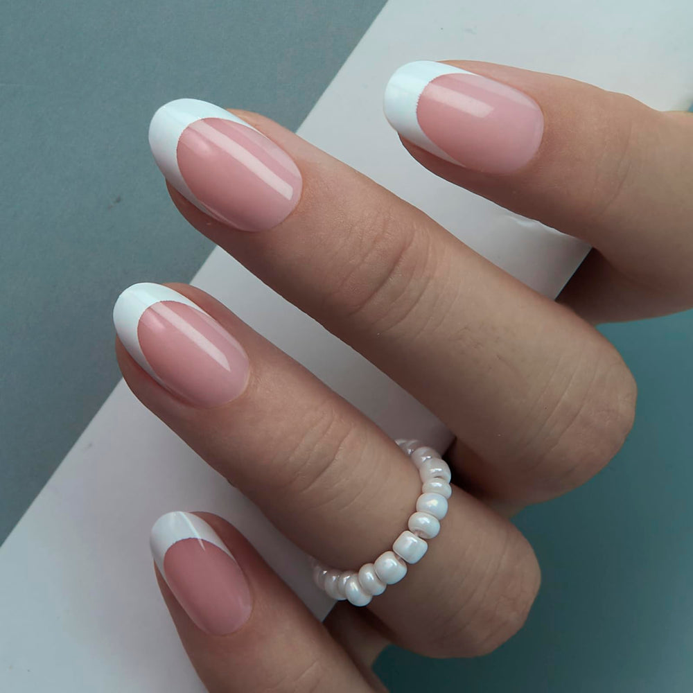 CurvLife hand applying a press-on nail demonstrating quick, secure at-home application