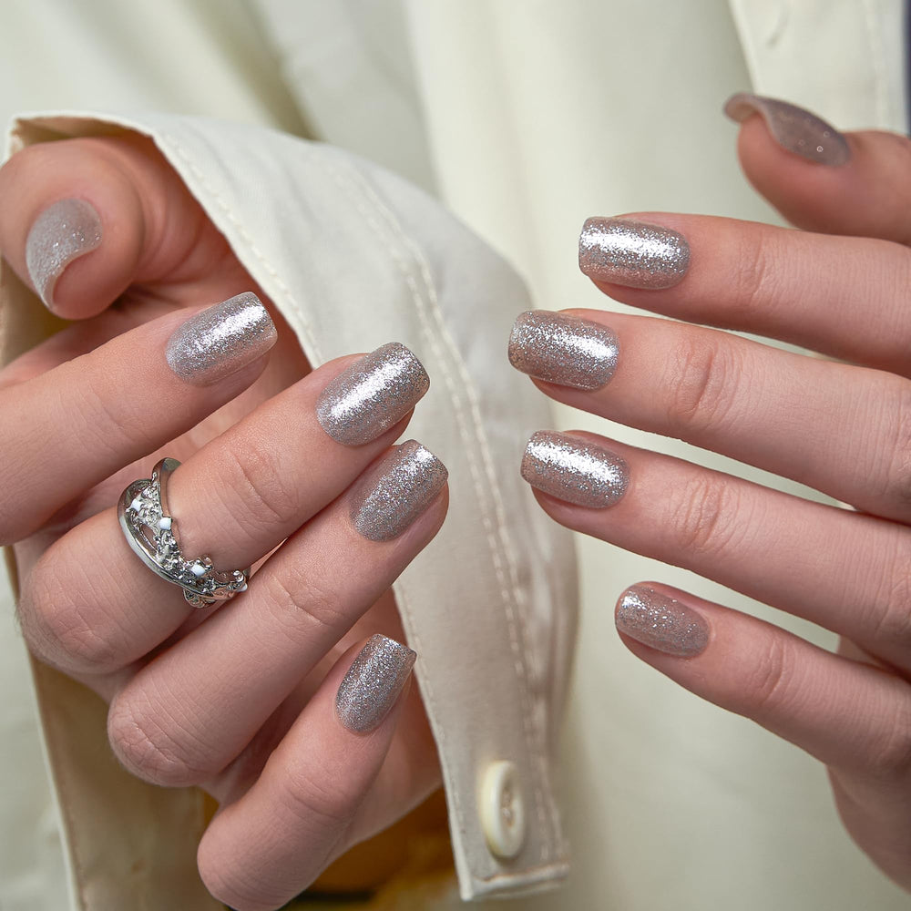 Curvlife nails shown during application with adhesive tab and glue demonstrating quick at-home use