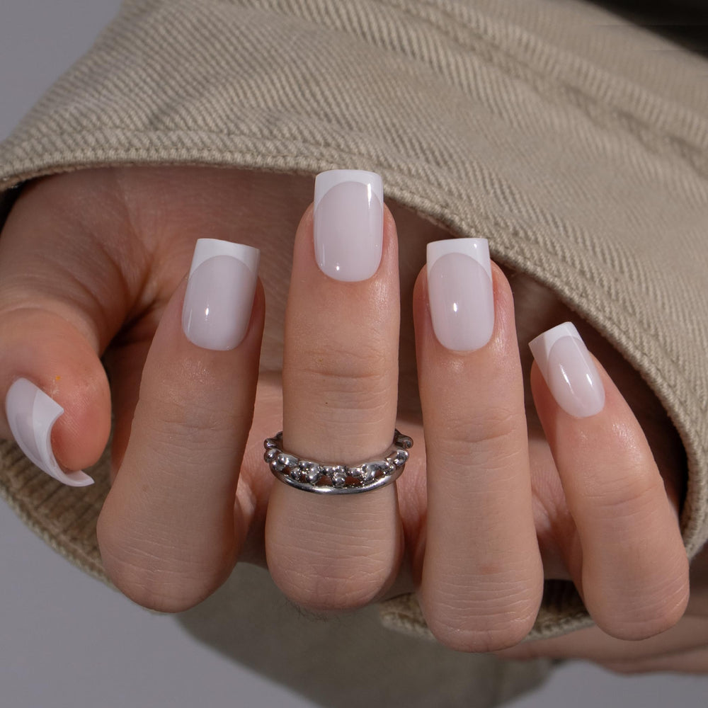 CurvLife nails applied on hand demonstrating natural short square fit