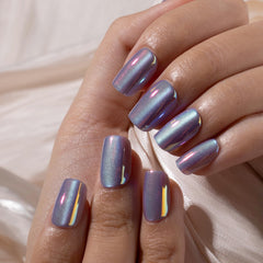 CurvLife nails on hand for scale illustrating full-cover shape and fit comfort
