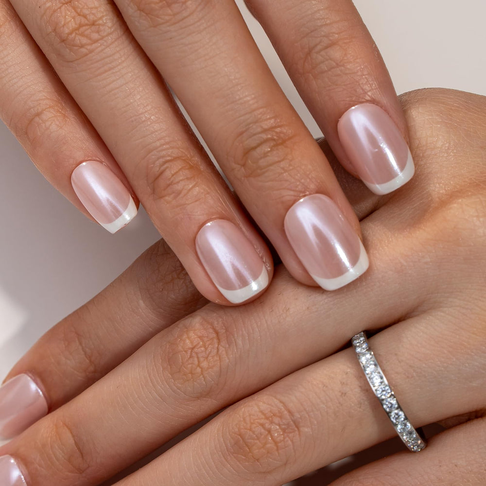 Curvlife nails worn on hands at a desk offering a polished everyday look