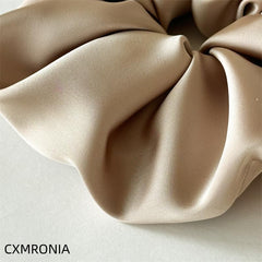 CXMRONIA oversized scrunchie laid flat to show large 18 cm diameter benefit