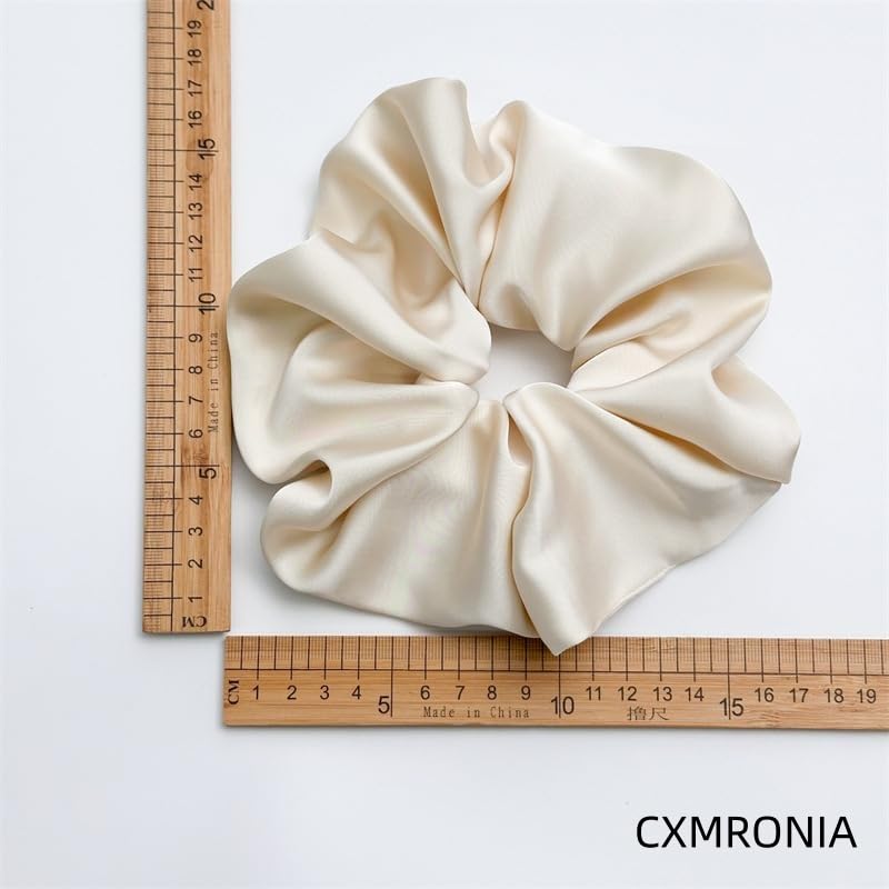 CXMRONIA scrunchie holding a high ponytail showing strong secure hold