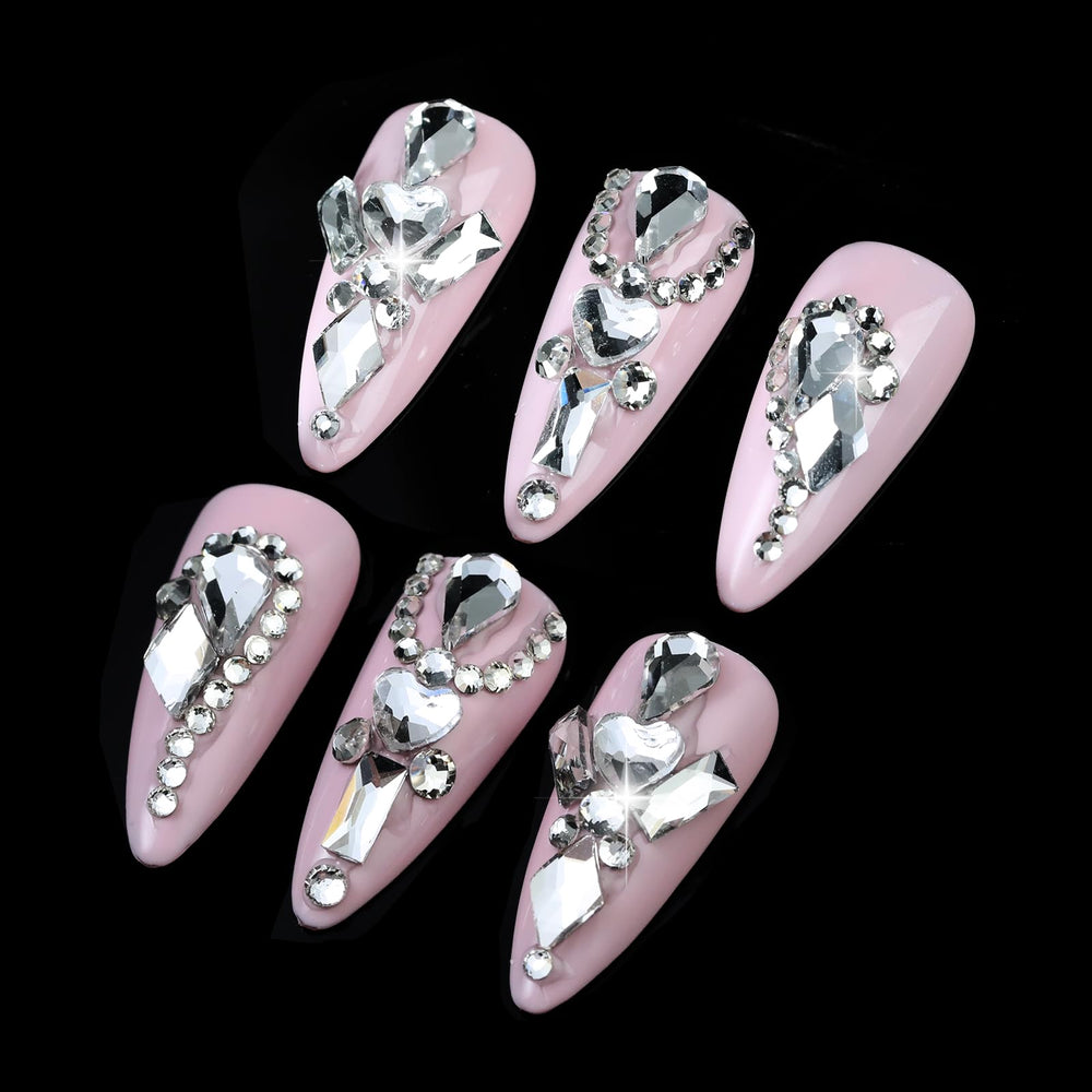 Cycullinyt tweezer and pickup pen placed beside crystals for precise placement