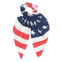 CYian scrunchie worn in a ponytail demonstrating secure hold and patriotic accent