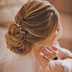 CYUXING clip clipped into a half-up hairstyle adding sparkle and elegance