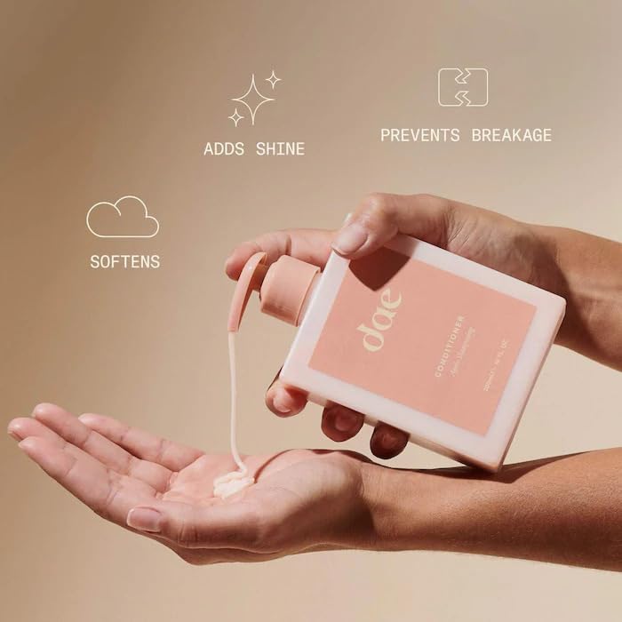 DAE conditioner in hand size comparison showing bottle scale and convenience
