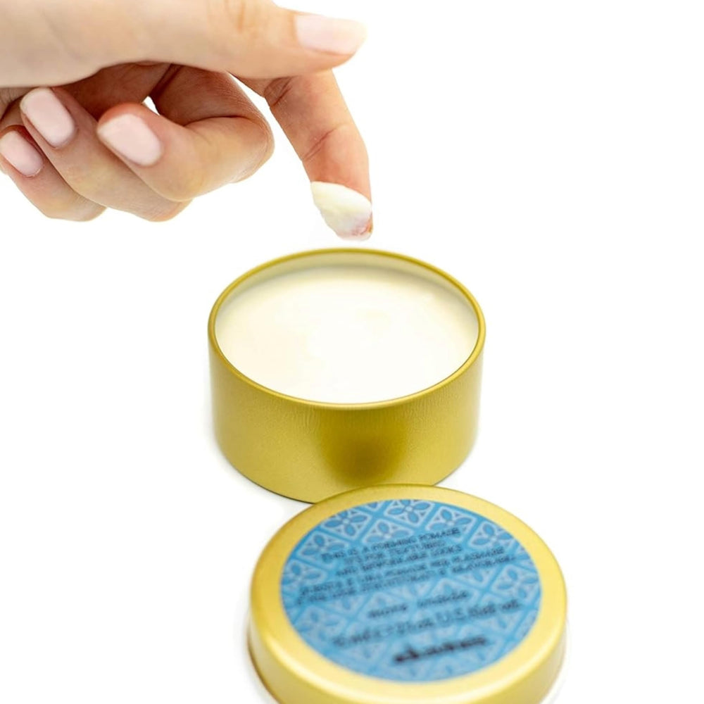 davines forming pomade in hand application demonstrating easy warm-up and even distribution
