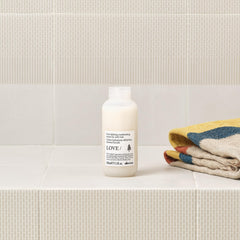 Davines LOVE CURL applied to wet hair showing curl formation and moisture