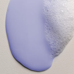 Hand dispensing Davines LOVE shampoo to show easy pump use and control