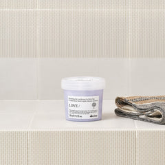 Davines LOVE SMOOTHING apple pulp extract close-up highlighting regenerative ingredient