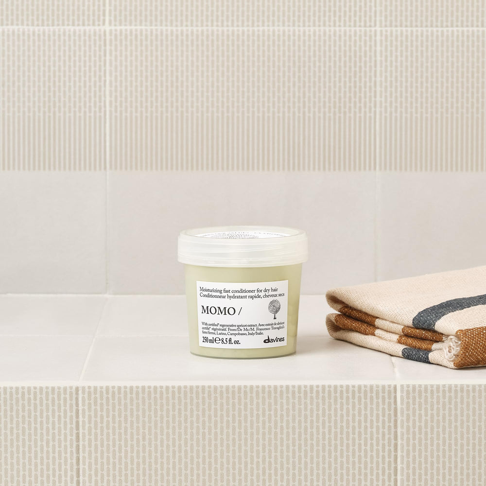 Davines MOMO conditioner cream texture demonstrating hydration and spreadability