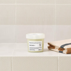 Davines MOMO conditioner cream texture demonstrating hydration and spreadability