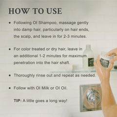Applying Davines OI conditioner to wet hair for easier detangling and manageability