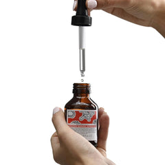 Davines travel-size bottle in hand demonstrating compact convenience