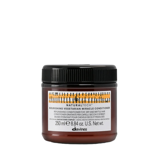 Davines bottle front view showing Vegetarian Miracle Conditioner benefits