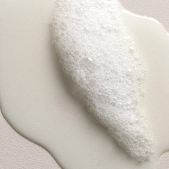Davines VOLU shampoo being massaged into fine hair for lift