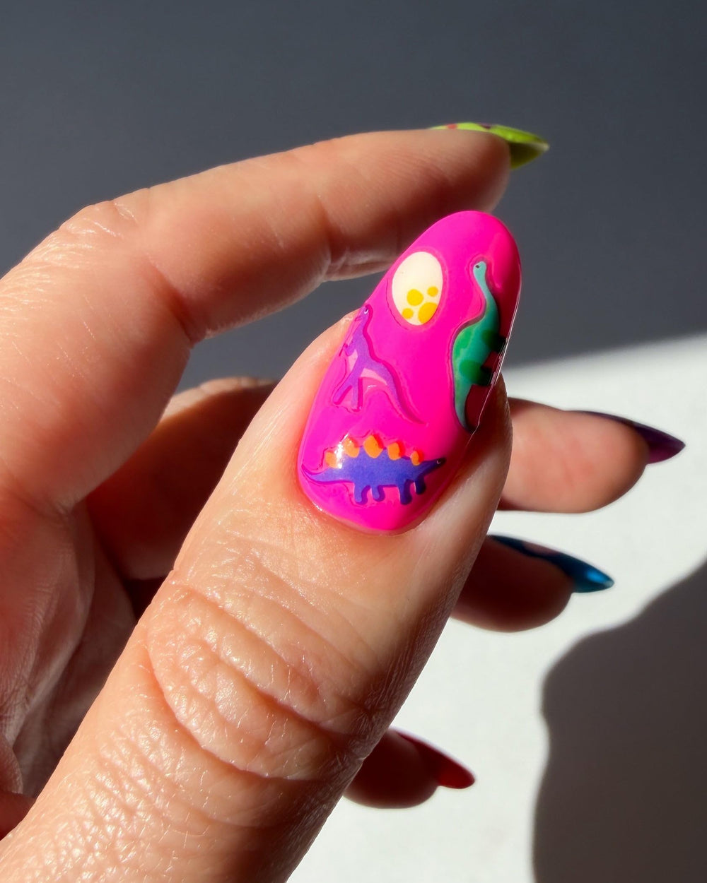 Deco Beauty stickers beside a ruler on a hand, demonstrates decal size and fit