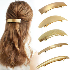 DeD front view of five gold metal barrettes showing elegant finish and versatility