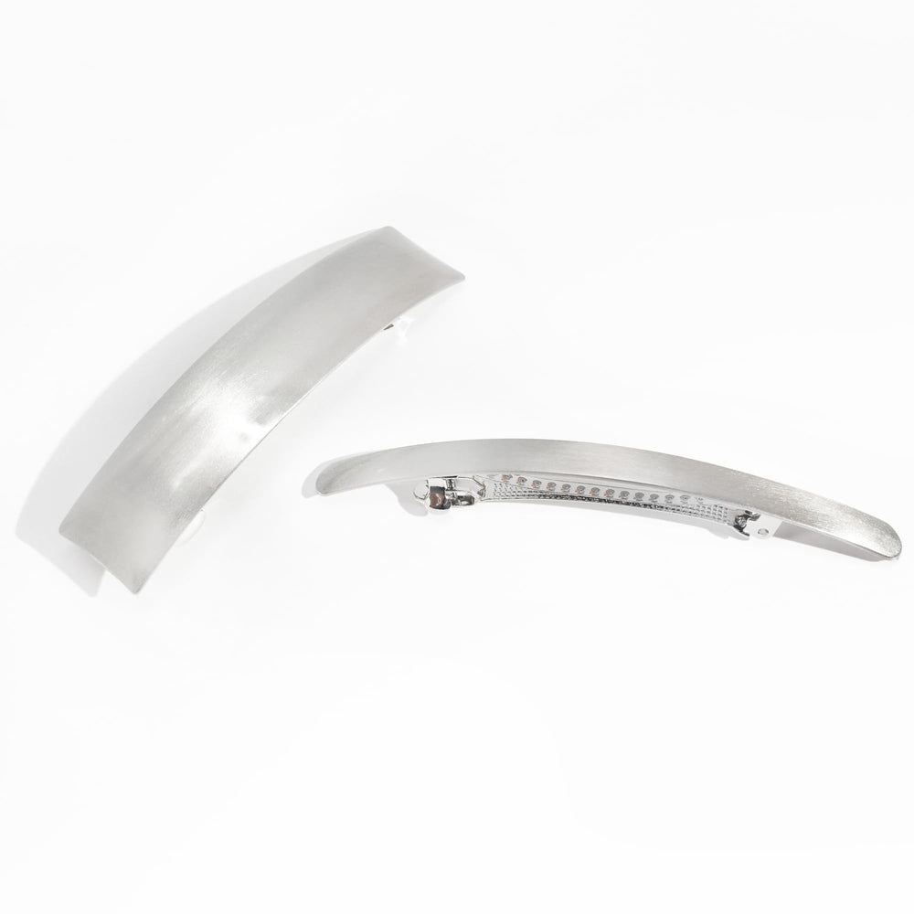 DED clip held in hand to show scale and size for long and medium hair compatibility