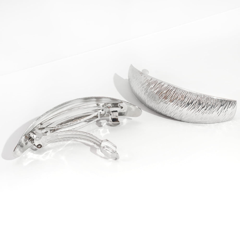 DED lifestyle shot of multiple clips used in an elegant updo for event-ready shine