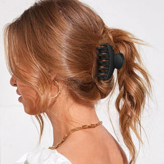DEEKA two clips securing a low bun for a neat, professional hairstyle