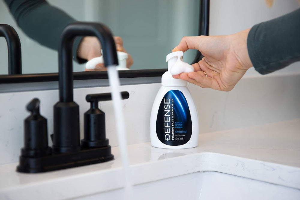 Defense Soap being used to wash hands, showing effective cleansing in use
