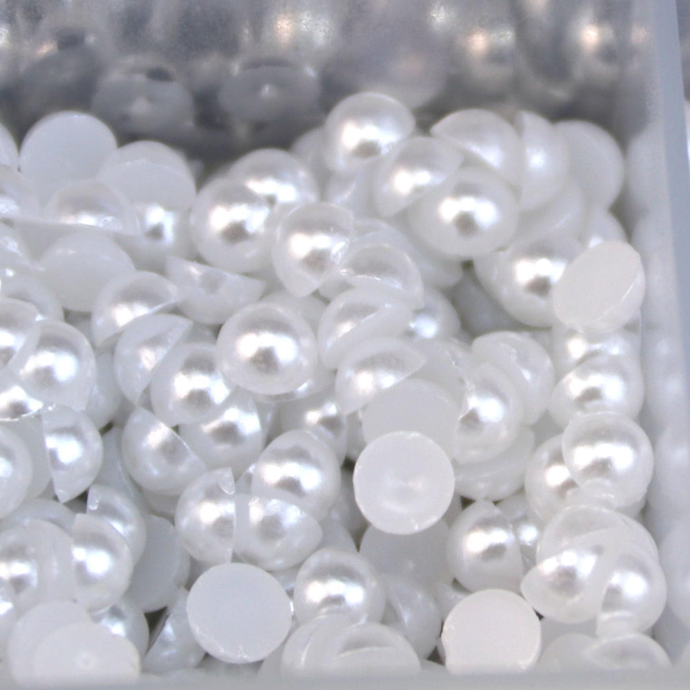 Delgoash tweezers lifting a pearl for precise placement and cleaner application