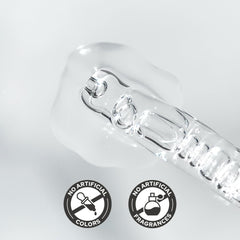 De:maf ampoule next to coin for size comparison showing travel-friendly volume