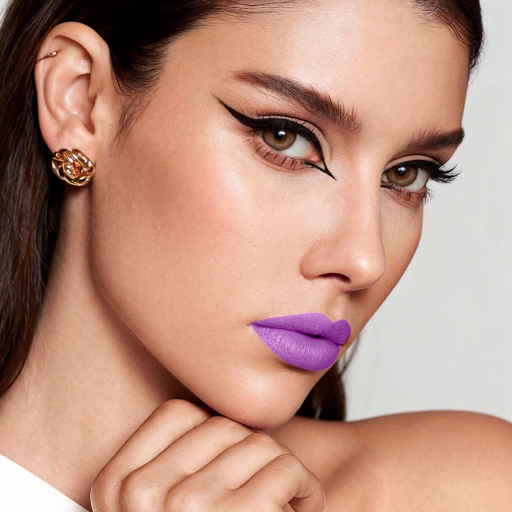 Depuplum purple swatch on skin reveals rich matte pigment and smooth texture